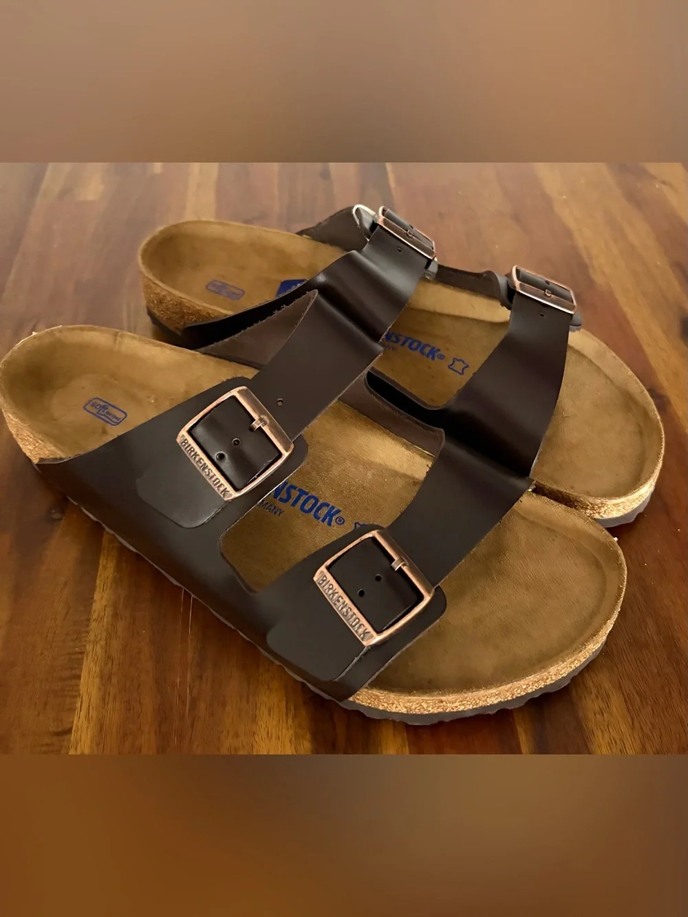 Birkenstock Men’s Arizona Two-Buckle Sandal — Dark Brown with Rose Gold Buckles.